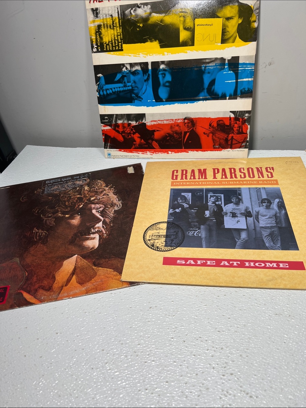 Vintage Vinyl Records Spanning Classic Folk, Early Country Rock, and Iconic 1980